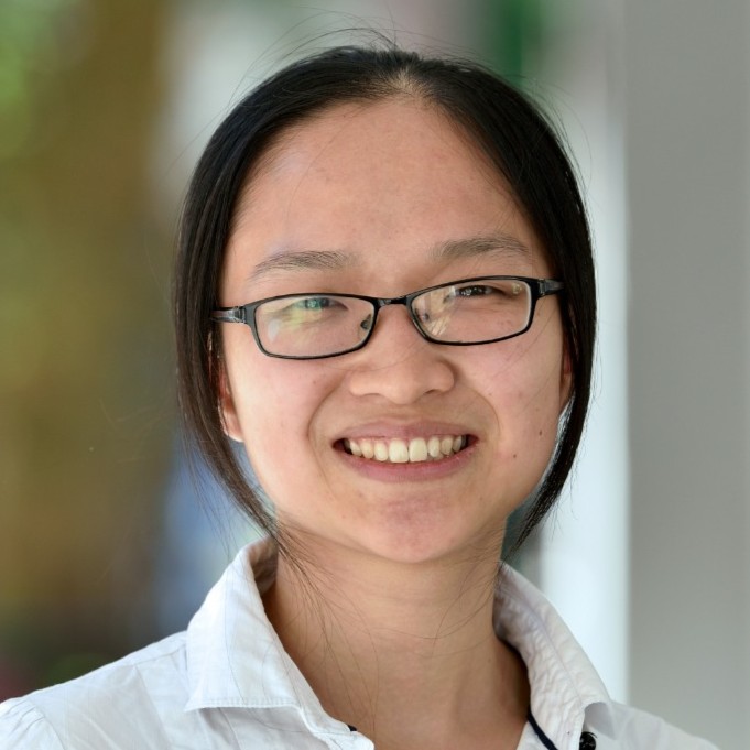 SYu Sqaure headshot of an East Asian woman wearing glasses and a white shirt
